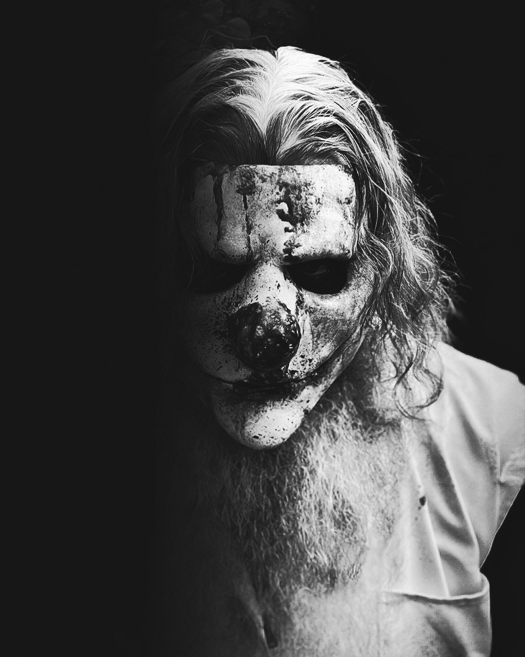 Black and white masked horror portrait